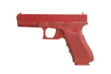 Image showing Dirty red training gun isolated on white