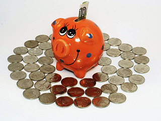 Image showing Bunch of coins and piggy bank