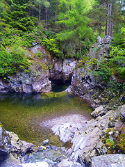 Image showing River deep in mountain forest.