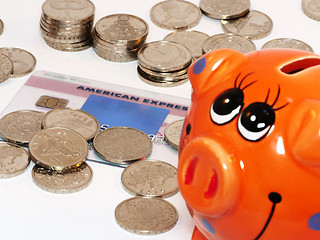 Image showing Bunch of coins and piggy bank