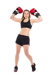 Image showing Young woman posing with boxing gloves