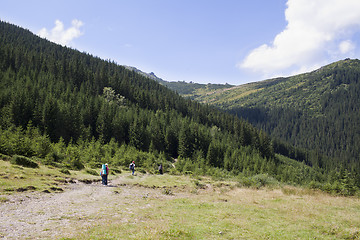 Image showing Happy hikers in mountains