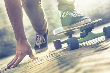 Image showing skateboarder riding skateboard