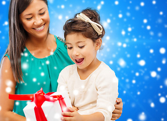 Image showing happy mother and little girl with gift box