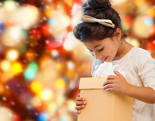 Image showing smiling little girl with gift box