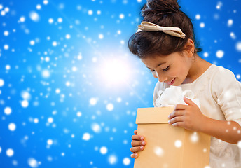 Image showing smiling little girl with gift box