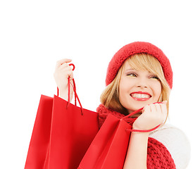 Image showing smiling young woman with shopping bags