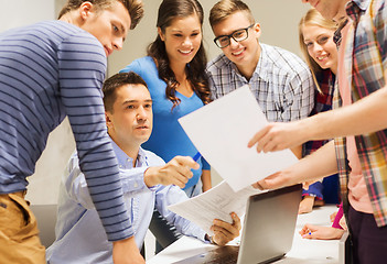 Image showing group of students and teacher with laptop