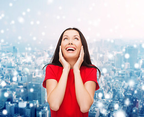 Image showing smiling woman in red dress