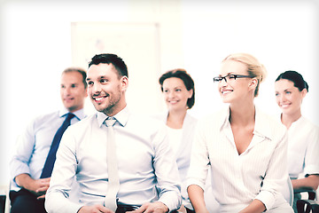 Image showing businessmen and businesswomen on conference