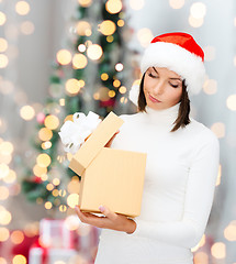 Image showing woman in santa helper hat with gift box