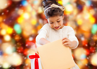 Image showing smiling little girl with gift box