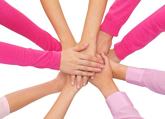 Image showing close up of women with hands on top