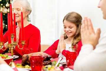 Image showing smiling family having holiday dinner at home