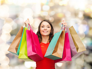 Image showing smiling woman with colorful shopping bags