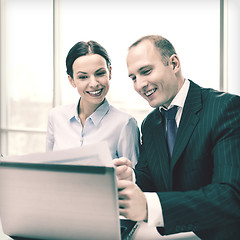 Image showing businessman and businesswoman having discussion