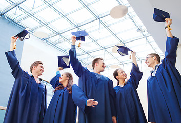 Image showing group of smiling students in mortarboards