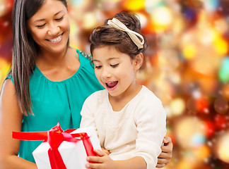 Image showing happy mother and little girl with gift box