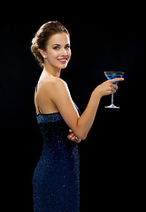 Image showing smiling woman holding cocktail