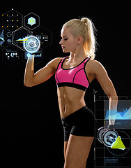 Image showing sporty woman with heavy steel dumbbells