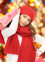 Image showing smiling young woman with shopping bags