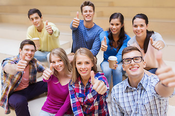 Image showing group of smiling students with paper coffee cups