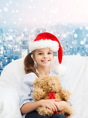 Image showing smiling little girl with teddy bear