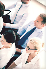 Image showing businessmen and businesswomen on conference