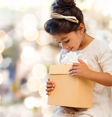 Image showing smiling little girl with gift box