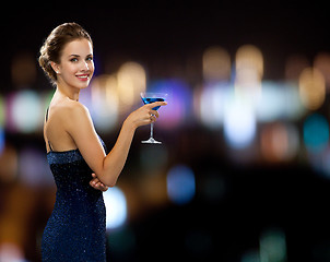 Image showing smiling woman holding cocktail