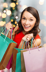 Image showing smiling woman with colorful shopping bags