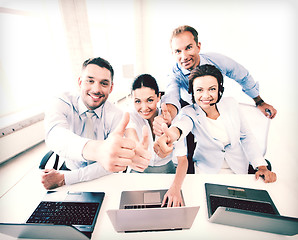 Image showing group of office workers showing thumbs up