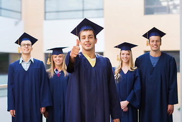 Image showing group of smiling students in mortarboards