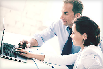 Image showing man and woman working with laptop in office