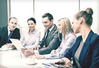 Image showing business team with tablet pc having discussion