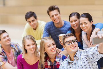 Image showing group of students with smartphone and coffee cup