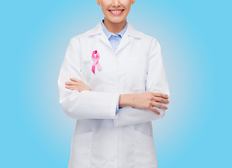 Image showing close up of doctor with cancer awareness ribbon