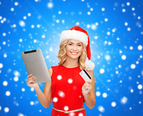 Image showing woman in santa hat with tablet pc and credit card