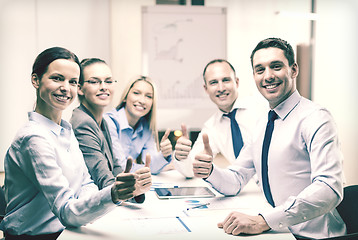 Image showing business team showing thumbs up in office