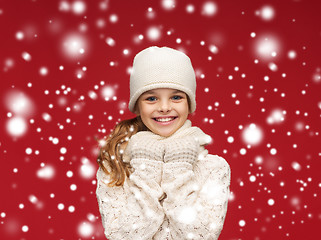 Image showing smiling girl in white hat, muffler and gloves