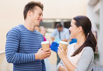 Image showing group of smiling students with paper coffee cups