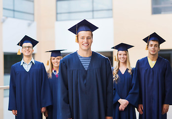 Image showing group of smiling students in mortarboards