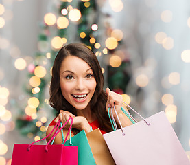 Image showing smiling woman with colorful shopping bags