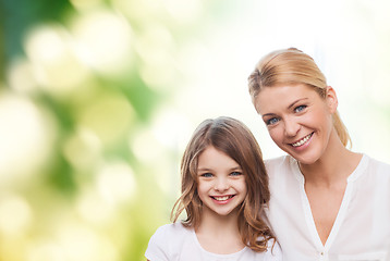 Image showing smiling mother and little girl
