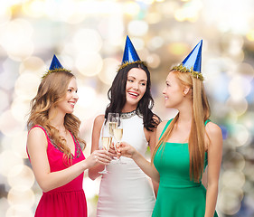 Image showing smiling women holding glasses of sparkling wine