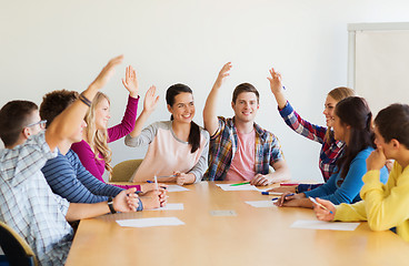 Image showing group of smiling students voting