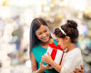 Image showing happy mother and little girl with gift box