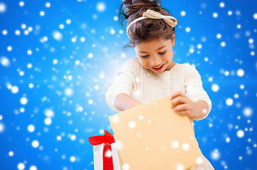 Image showing smiling little girl with gift box