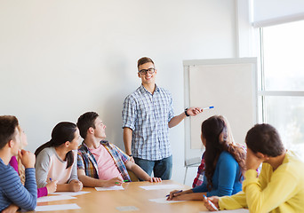 Image showing group of smiling students with white board