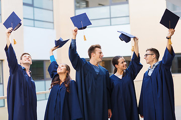 Image showing group of smiling students in mortarboards